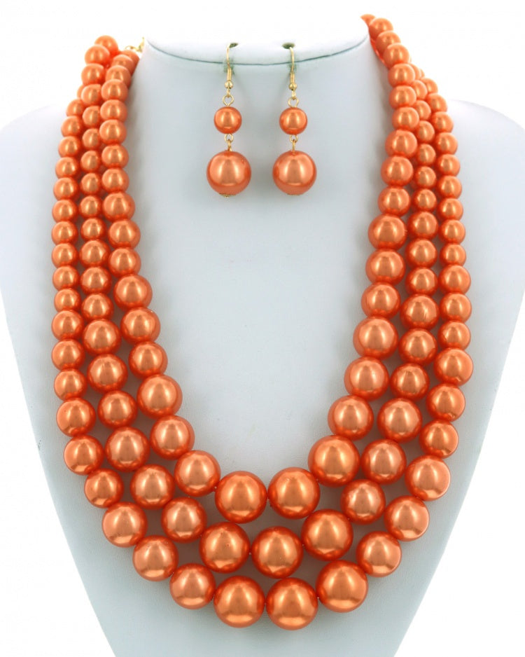 TRIPLE STRAND ORANGE PEARL NECKLACE SET